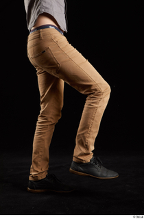 Falco White 1 black shoes brown trousers dressed flexing leg…